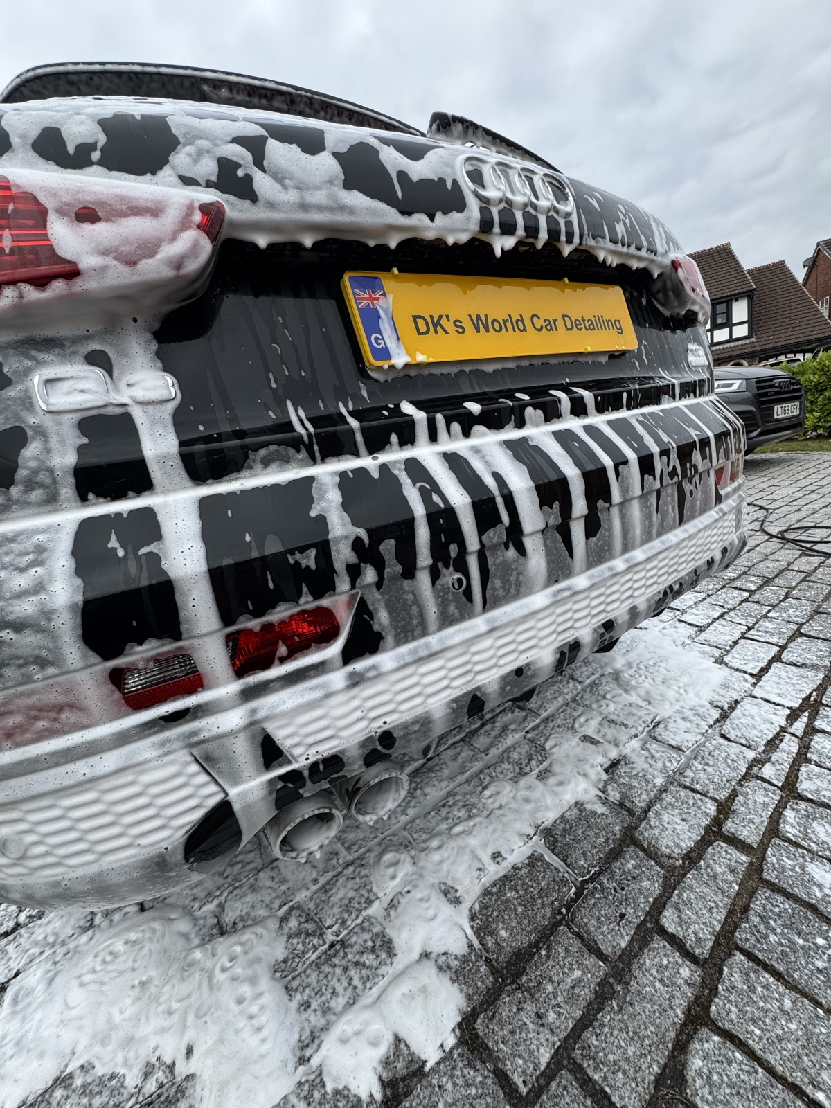 Audi rear end covered in snow foam during a pre-wash in Prescot