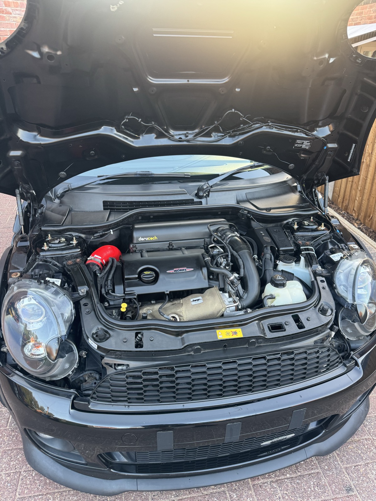 Detailed MINI Cooper S engine bay cleaned during a valet in Prescot