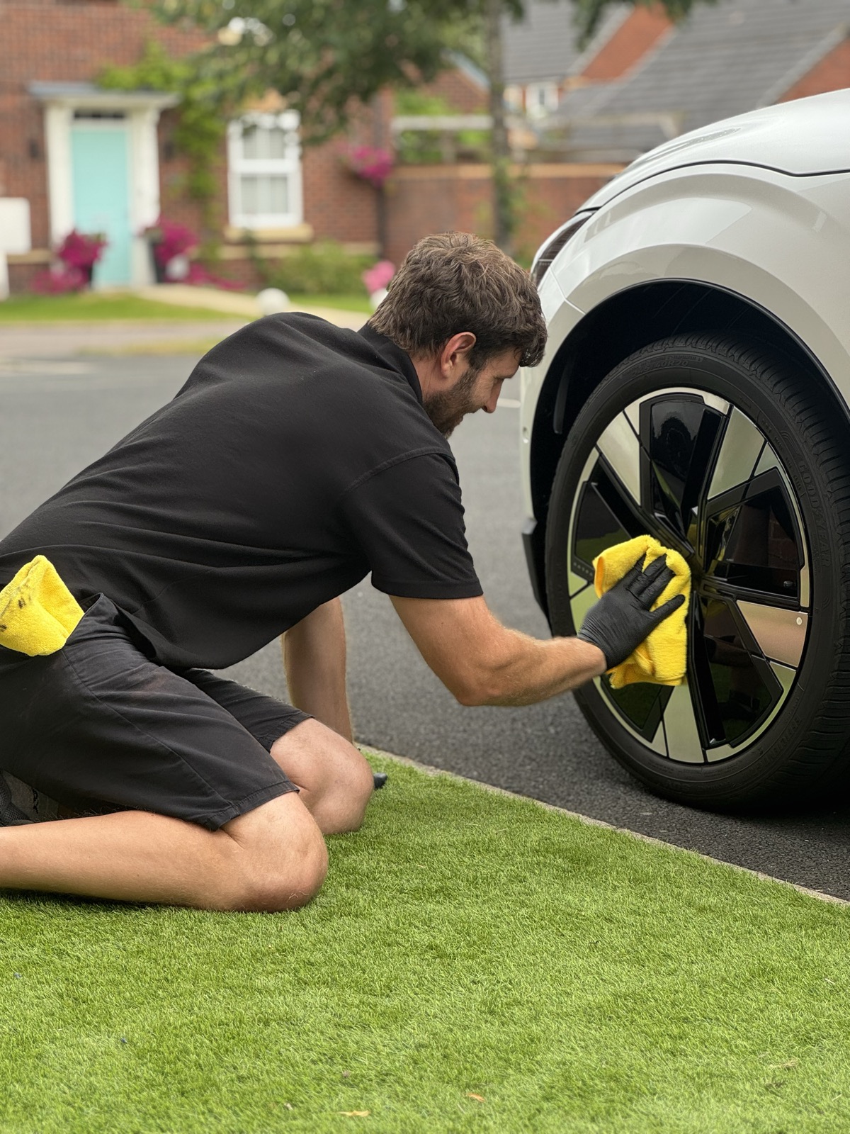 DK's World Car Detailing technician hand-polishing an alloy wheel in Warrington